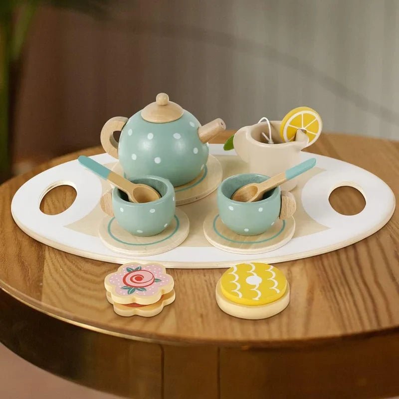 CSSV FILE afternoon tea set with teapot, cups, and saucers arranged on a table for elegant tea service.