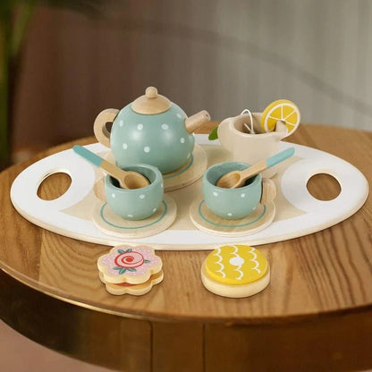 CSSV FILE afternoon tea set with teapot, cups, and saucers arranged on a table for elegant tea service.