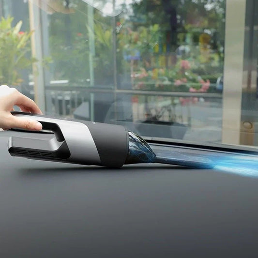 Hoco PH16 vacuum car cleaner by CSSV FILE, handheld device with nozzle and dust container, on a car interior background.