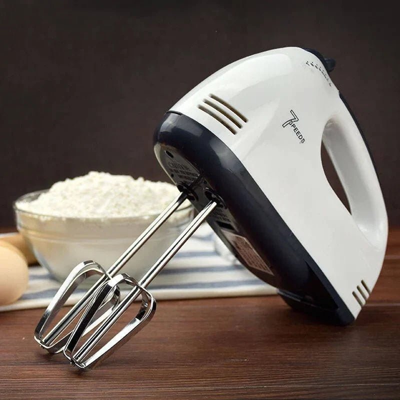 CSSV FILE Super Hand Mixer with multiple speed settings and ergonomic handle, shown in use for mixing batter.